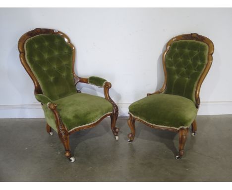 Two Victorian carved walnut fireside chairs, ladies and gentleman's in green button back material