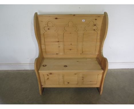 A modern Gothic style pine hall bench with a lift up seat - Height 1.13m x Width 96cm x Depth 47cm - Good clean condition