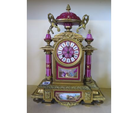 A 19th century ormolu and porcelain Japy Freres mantle clock surmounted with a lidded urn the back plate numbered 12057 CHLES