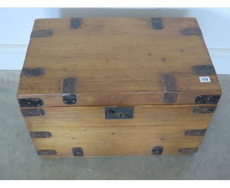 A Victorian stripped and waxed metal bound pine travel trunk - 38cm x 61cm x 38cm 