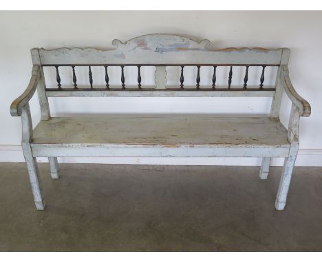A 19th century pine bench with shaped arms and decorative spindle back in original colours - a very good example - 104cm x 16