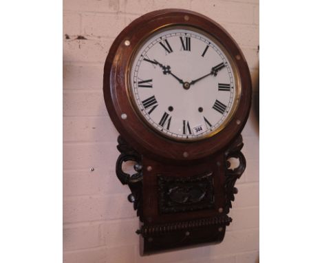 An eight day drop trunk inlaid American wall clock with a 12" dial
Condition report:  Has key and pendulum, some restoration 