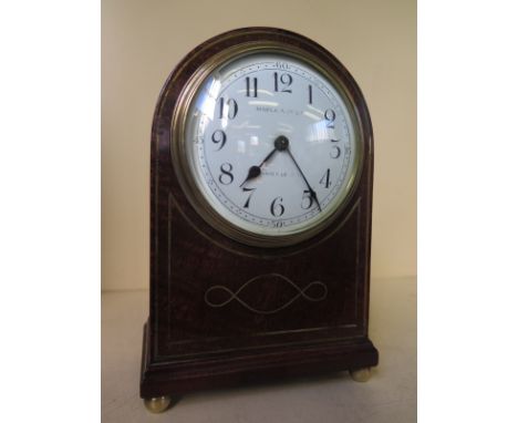 A dome top mantel clock with platform movement - by Maple and Co Ltd. Paris and London
Condition report:   Working with key 