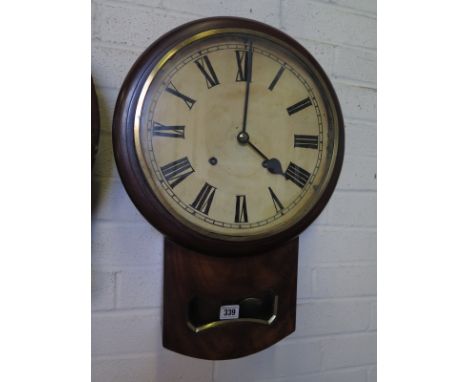 A mahogany case drop trunk 12" dial wall clock 
Condition report: With key and pendulum