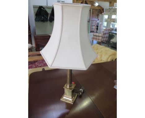 A brass Corinthian table lamp - tested - Height 70cm