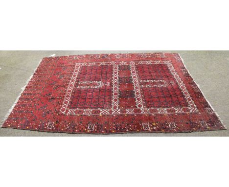 An Afghan Ersari Hatchli, claret quartered field of candela motifs enclosded by borders of geometric devices, 211cm by 160cmD