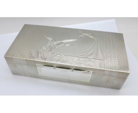 A heavy silver cigarette box with engine turned duck decoration, Birmingham 1947, by A. Wilcox, total weight with liner 648g,