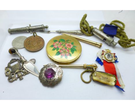 A tigers eye set bookmark, The Acme City whistle, a compact, a plated Eversharp pencil, etc. 