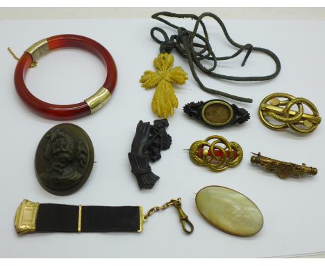 A collection of jewellery including jet, a Nanny pin brooch, a bangle, etc. 
