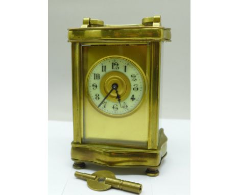 A French brass and glass carriage clock with key 