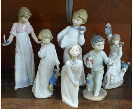 One Lladro and five Nao by Lladro figurines of children at bedtime. ?Girl Kissing (goodnight)? (Lladro ref 4873), ?To Light t