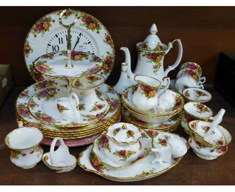 Royal Albert Old Country Roses tea and dinnerwares, four setting, clock, cake stand, dishes, candlesticks, etc. 