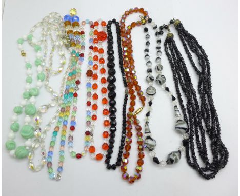 Nine vintage glass bead necklaces, one requires repair/re-stringing 