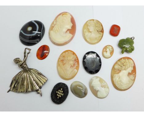 A carved shamrock shaped pendant set with a compass, a silver ballerina brooch, five unmounted cameos, a seal stone, etc. 