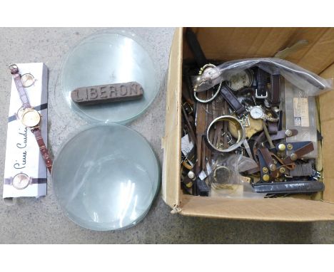 Assorted watch spares, watches, clock glasses, etc. 