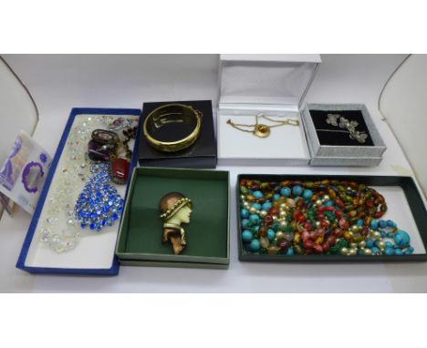 A rolled gold bangle, swivel fob, paste set and other costume jewellery 