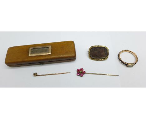 Mourning jewellery including yellow metal ring set with black stones, a mourning brooch, a yellow metal mounted treen box wit