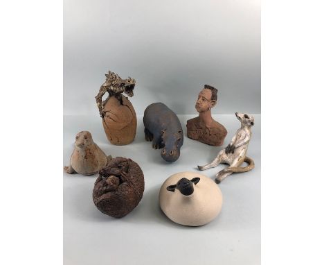 Pottery sculptures, a collection of art studio sculptures to include a Hippo, meerkat, Dragon and egg, Armadillo, seal , shee