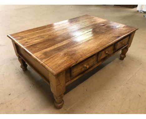 Modern light wood coffee table with three drawers to each long side, approx 120cm x 80cm x 45cm