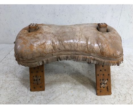 Leather seated camel stool with stud work detailing and bell 