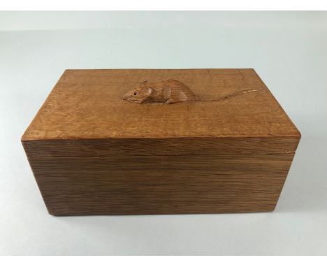 Robert Mouseman Thompson (Kilburn), an Oak Trinket Box and Cover, of rectangular form, the cover with carved mouse approx 18.