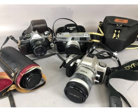 Vintage Cameras, 3 35mm SLR camera being a Canon AE-1, Canon QL25, Minolta DYNAX 505si and and a canon 135 mm lens and 28mm l