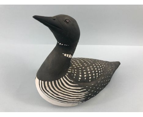 Pottery sculpture, a naturalistic art sculpture of a Guillemot in unglazed pottery approximately 28 x 23cm 