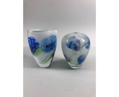 studio art glass, two twin layered vases of blue flowers on an opaque white background both with pontil bottoms