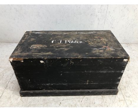 Black painted pine trunk with metal handles to side and plinth to base, approx 95cm x 51cm x 48cm