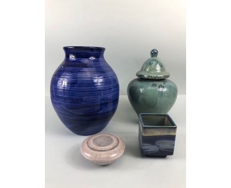 Studio Art Pottery, four items of studio pottery being a green glazed stone ware lidded pot, a blue glazed pot vase, a small 