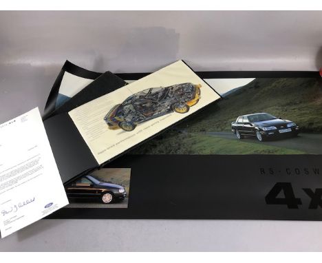 Motoring interest , being a  dealership poster for the R S Cosworth 4X4 in its original protective tube , and a Cosworth 4 x 
