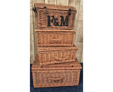 A collection of four vintage F&amp;M wicker baskets 