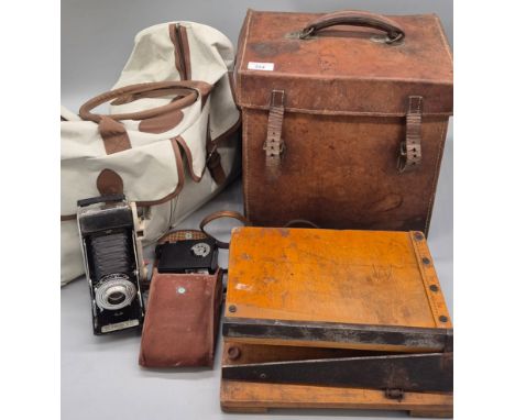 A Selection of collectables items; Antique doctor style case, 1900s cutting guillotine, Kodak sterling model 2 bellows camera