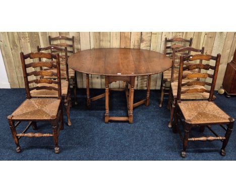 Antique style oak drop end dining table together with four matching Rattan and oak ladder back chairs. Comes with two 19th ce