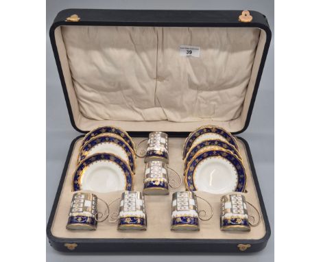 Boxed Aynsley coffee can and saucers set fitted with Sheffield silver cup inserts. Comes within a presentation box. 