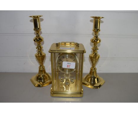 PAIR OF BRASS CANDLESTICKS AND BRASS MANTEL CLOCK