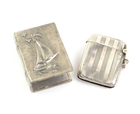 Engine turned silver vesta case, Birmingham, 1920 and a white metal yacht or boat design matchbox holder