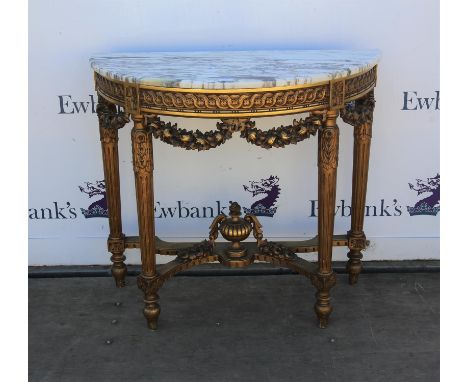 French Style giltwood console table, the demi-lune marble top on a guilloche and garland carved frieze on fluted legs joined 