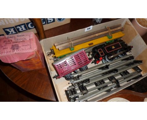 Boxed Hornby Series '0' gauge flat truck with container, 82011 engine, log wagon, another wagon and some track