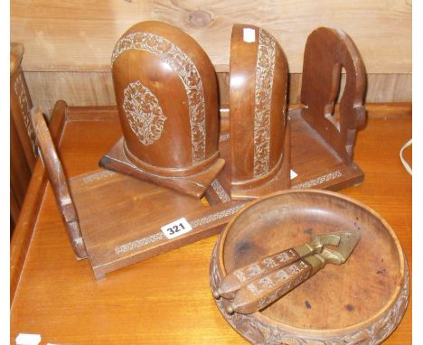 Carved folding hardwood book-rack, pair of similar bookends, bowl and similar nutcracker
