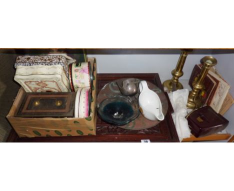 Shelf of assorted items including carved tray, a pair of brass candlesticks etc