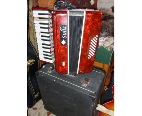 Stella piano accordion in case