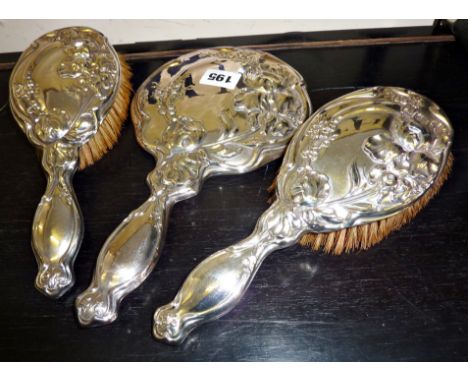 Art Nouveau silver three-piece brush & mirror set, hallmarked Birmingham 1916, by F.H. Adams Ltd