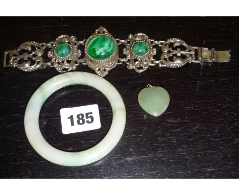 Jade bangle, a jade heart-shaped pendant, and a Continental white metal bracelet set with three malachite stones