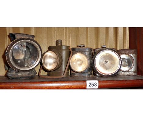 WW2 cycle lamp/torch, three others similar and a Lucas Silver King cycle lamp