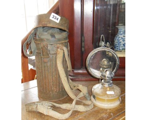 WW2 German gas mask (later filter) with canister, together with a small oil lamp with glass reservoir and attached mirror ref