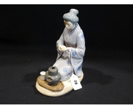     A Lladro Porcelain Figure Of Oriental Lady Taking Tea                           