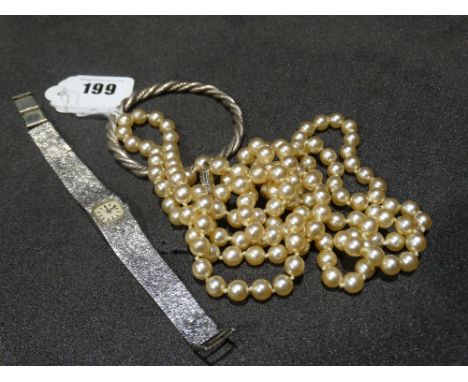     A White Metal Caravelle Ladies Wrist Watch, Together With A Bangle &amp; String Of Simulated Pearls                      