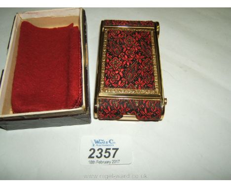 A multi-purpose decorative Compact with powder, lipstick, and manicure set, with cover and box.