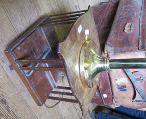 A mahogany table top revolving bookcase, with shaped top, 38cm square, and a brass table lamp, 46cm high (2)